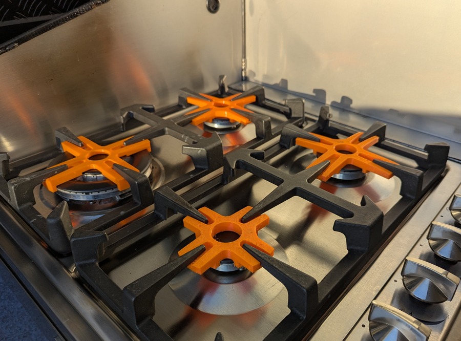 Stova caravan stove top holder securing device installed on Long Haul Campers T-REX cooktop